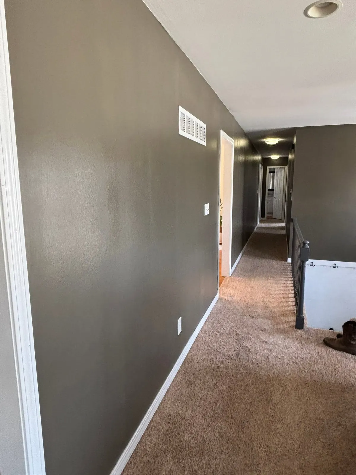 Long hallway with crisp baseboards